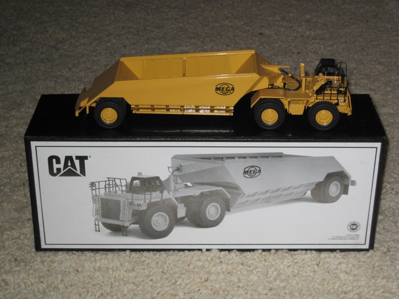 Caterpillar 776 w/ Mega belly dump trailer yellow